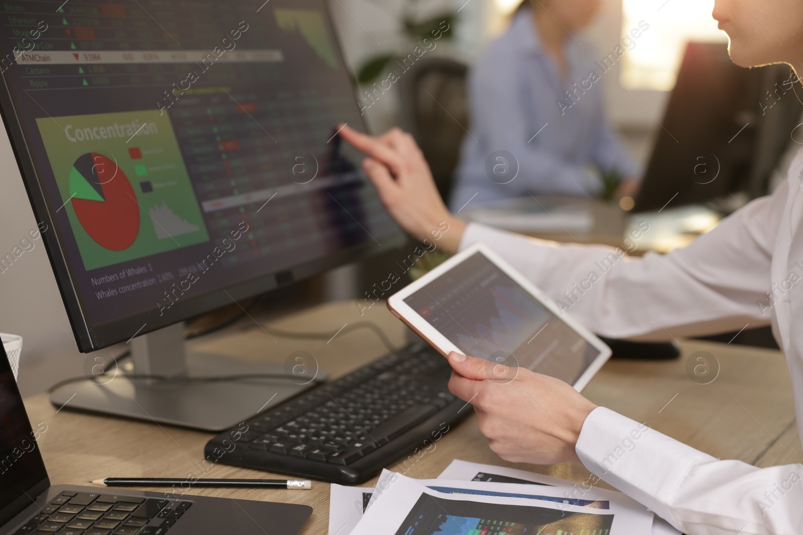 Photo of Stock exchange. Woman working at desk in office, closeup