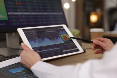 Photo of Stock exchange. Woman working at desk in office, closeup