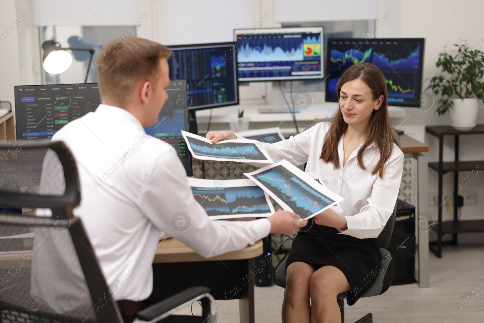 Photo of Stock exchange. Colleagues working together in office