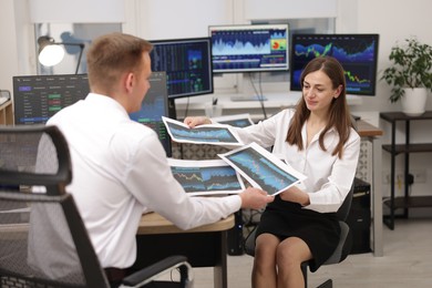 Photo of Stock exchange. Colleagues working together in office