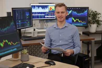 Stock exchange. Man working at desk in office