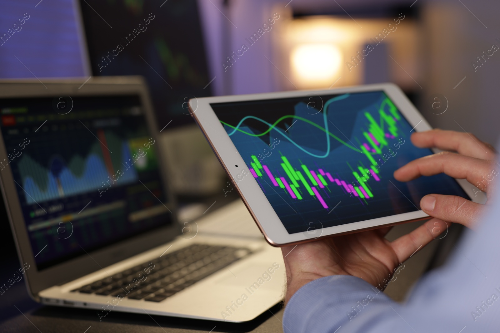 Photo of Stock exchange. Man working in office at night, closeup