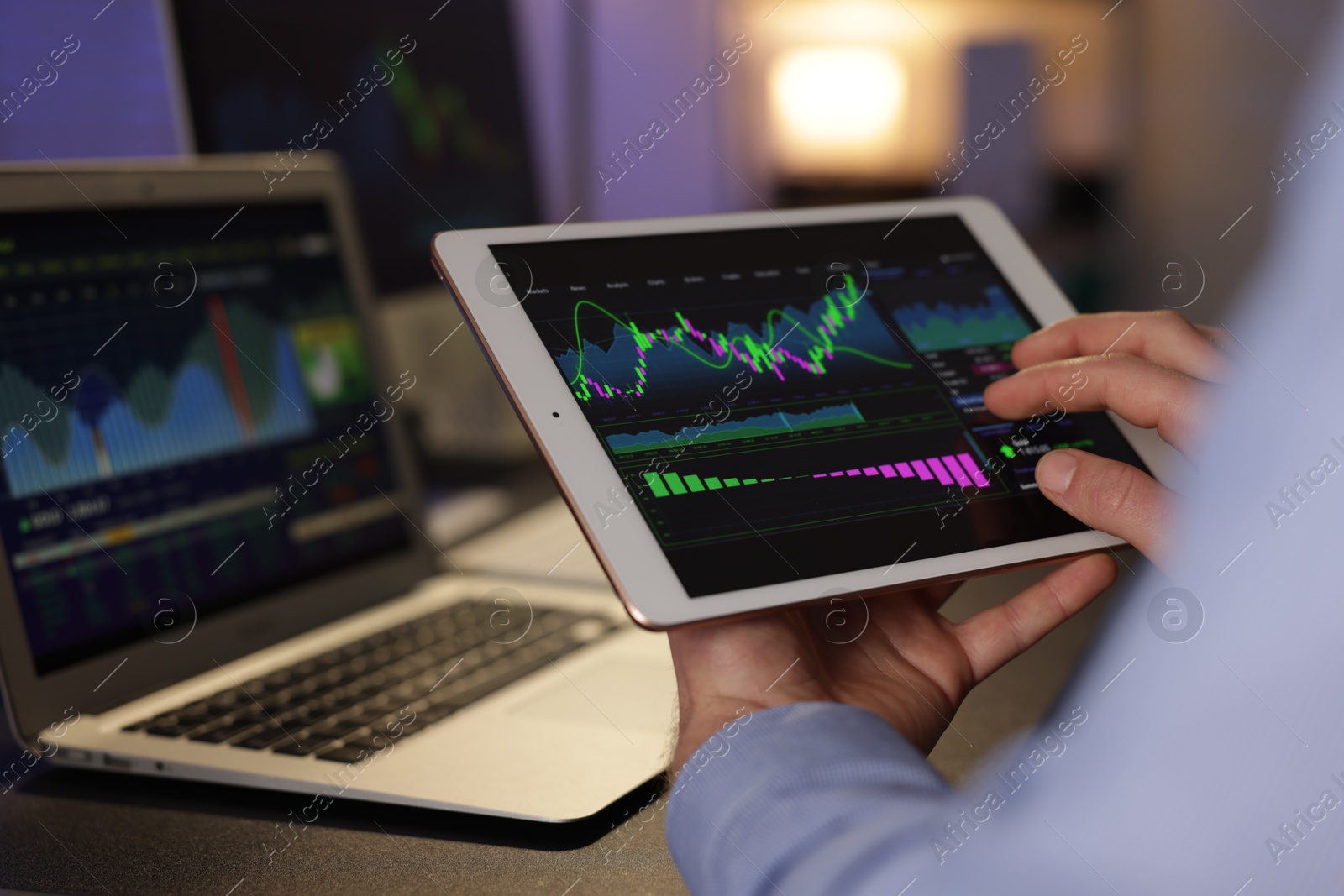 Photo of Stock exchange. Man working in office at night, closeup