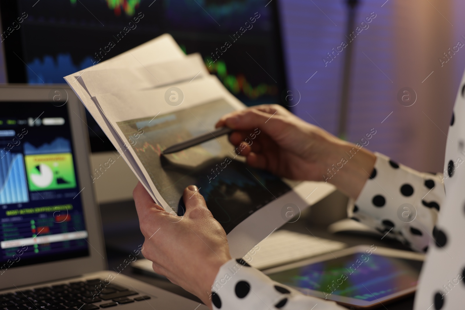 Photo of Stock exchange. Woman working in office at night, closeup