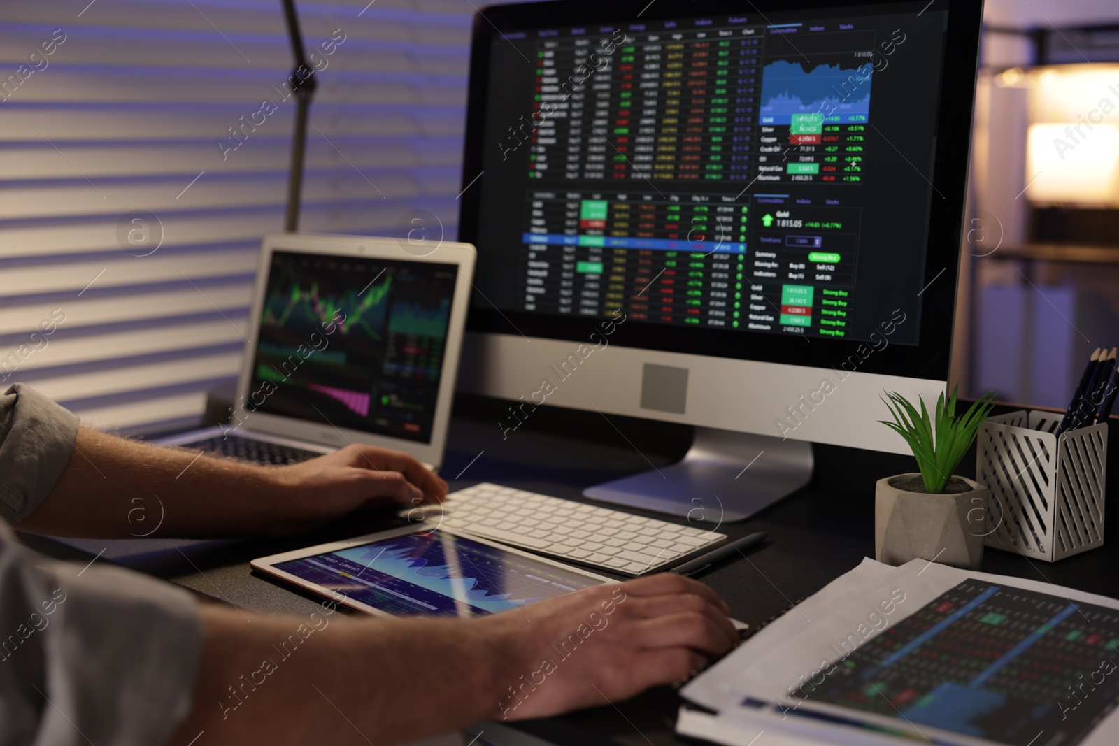 Photo of Stock exchange. Man working in office at night, closeup