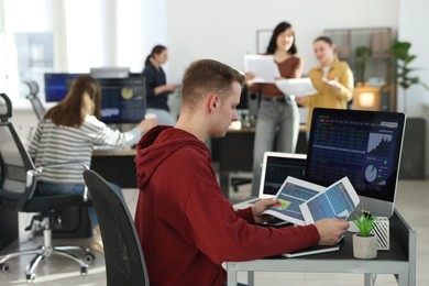 Stock exchange. Man working at desk in office