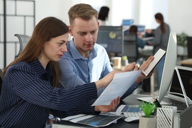 Photo of Stock exchange. Colleagues working together in office