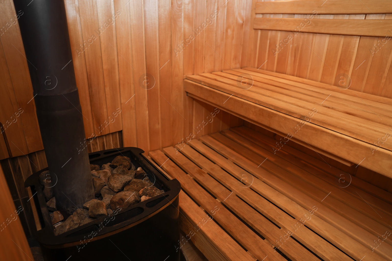 Photo of View of empty wooden sauna with bench