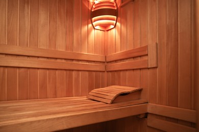 Photo of View of empty wooden sauna with bench