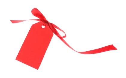 Photo of Blank tag with ribbon bow isolated on white