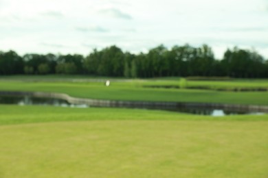 Photo of Blurred view of golf course on sunny day