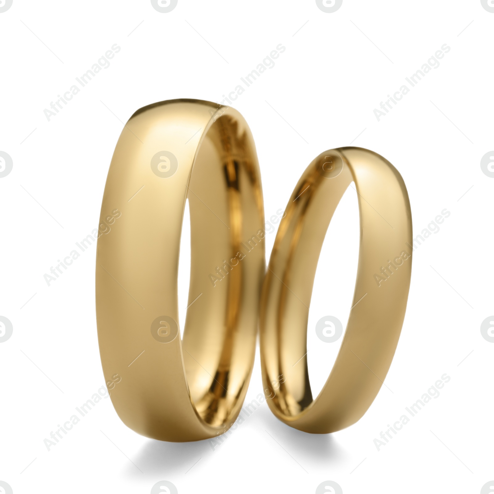 Photo of Beautiful golden wedding rings isolated on white