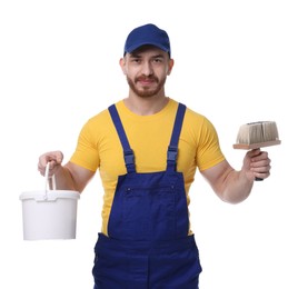 Professional painter with brush and bucket of paint on white background