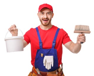 Photo of Emotional painter with brush and bucket of paint on white background