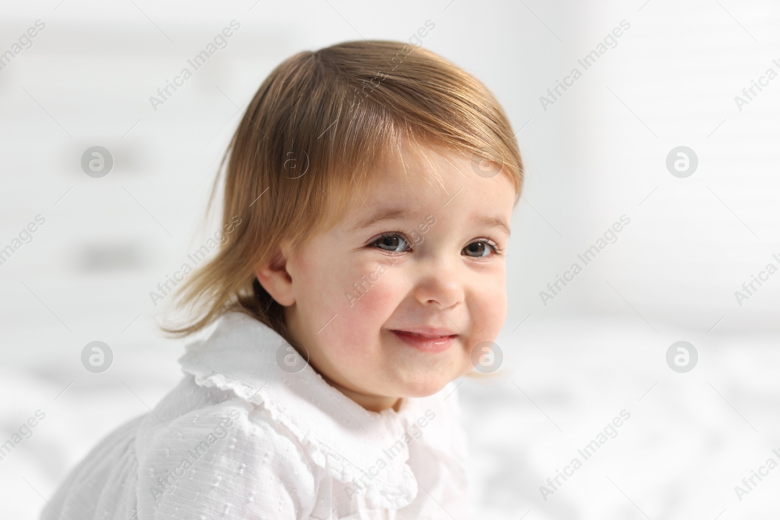 Photo of Portrait of cute little baby girl at home