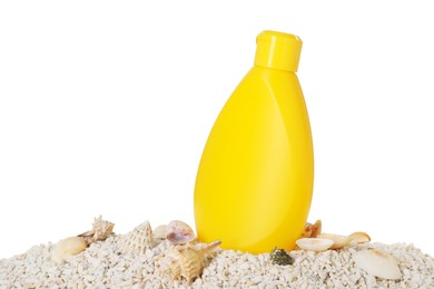 Bottle of sun protection product and seashells on pebbles against white background