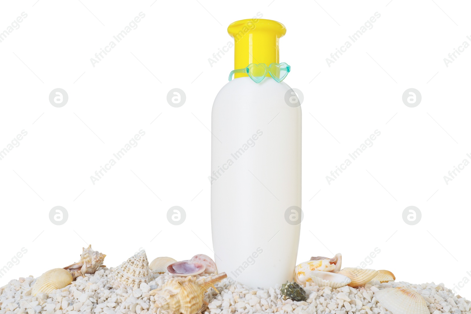 Photo of Bottle of sun protection product and seashells on pebbles against white background