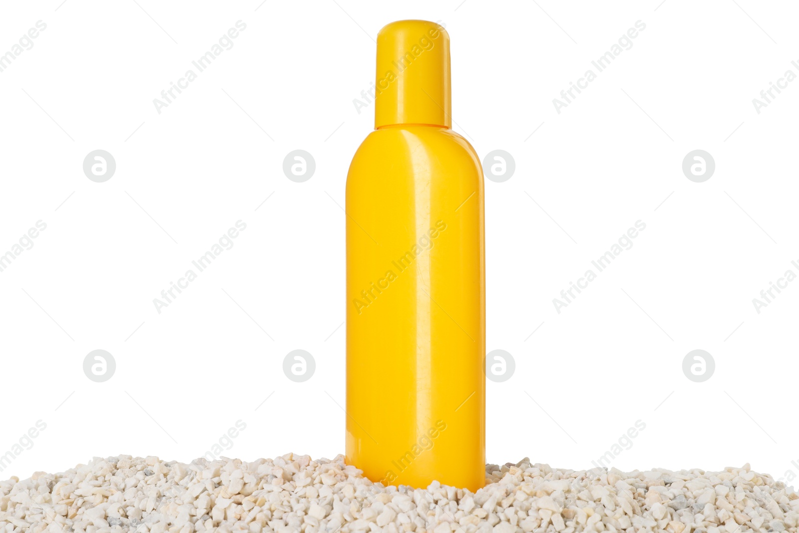 Photo of Bottle of sun protection product and seashells on pebbles against white background