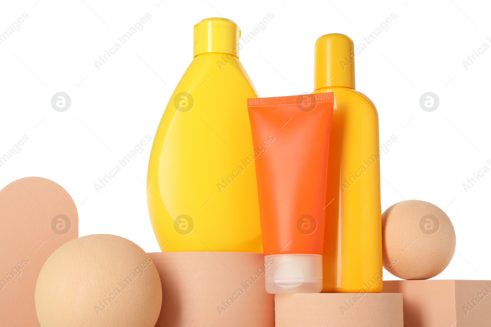 Photo of Different sun protection products on podiums against white background