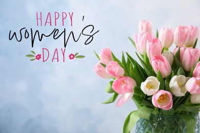 Image of Happy Women's day card. Beautiful tulips on vase on light blue background