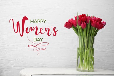 Happy Women's day card. Glass vase with beautiful crimson color tulips on table