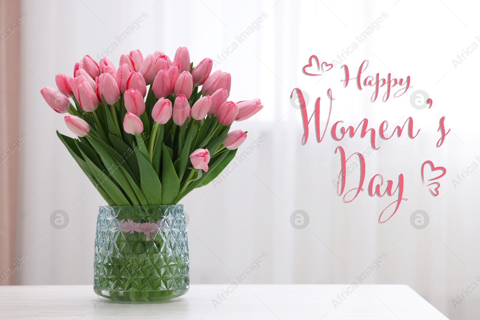 Image of Happy Women's day card. Glass vase with bouquet of beautiful pink tulips on table indoors