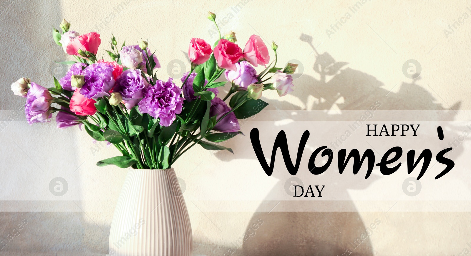 Image of Happy Women's day card. Beautiful eustoma flowers in vase near beige wall