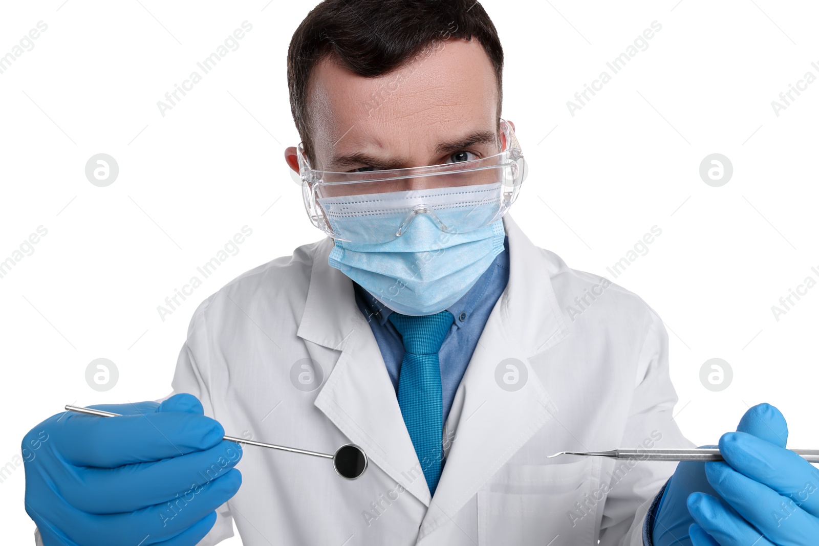 Photo of Professional dentist with tools on white background