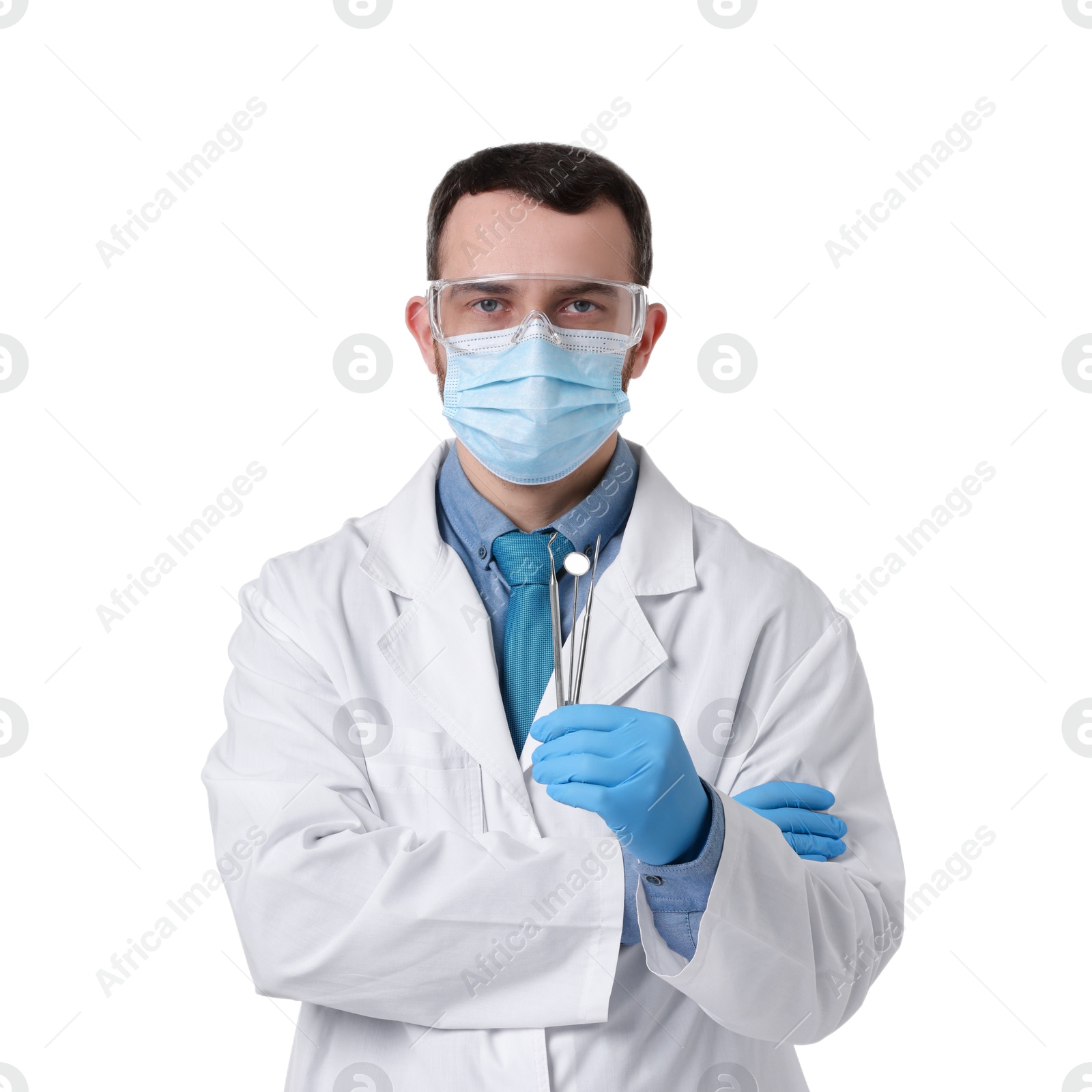 Photo of Professional dentist with tools on white background