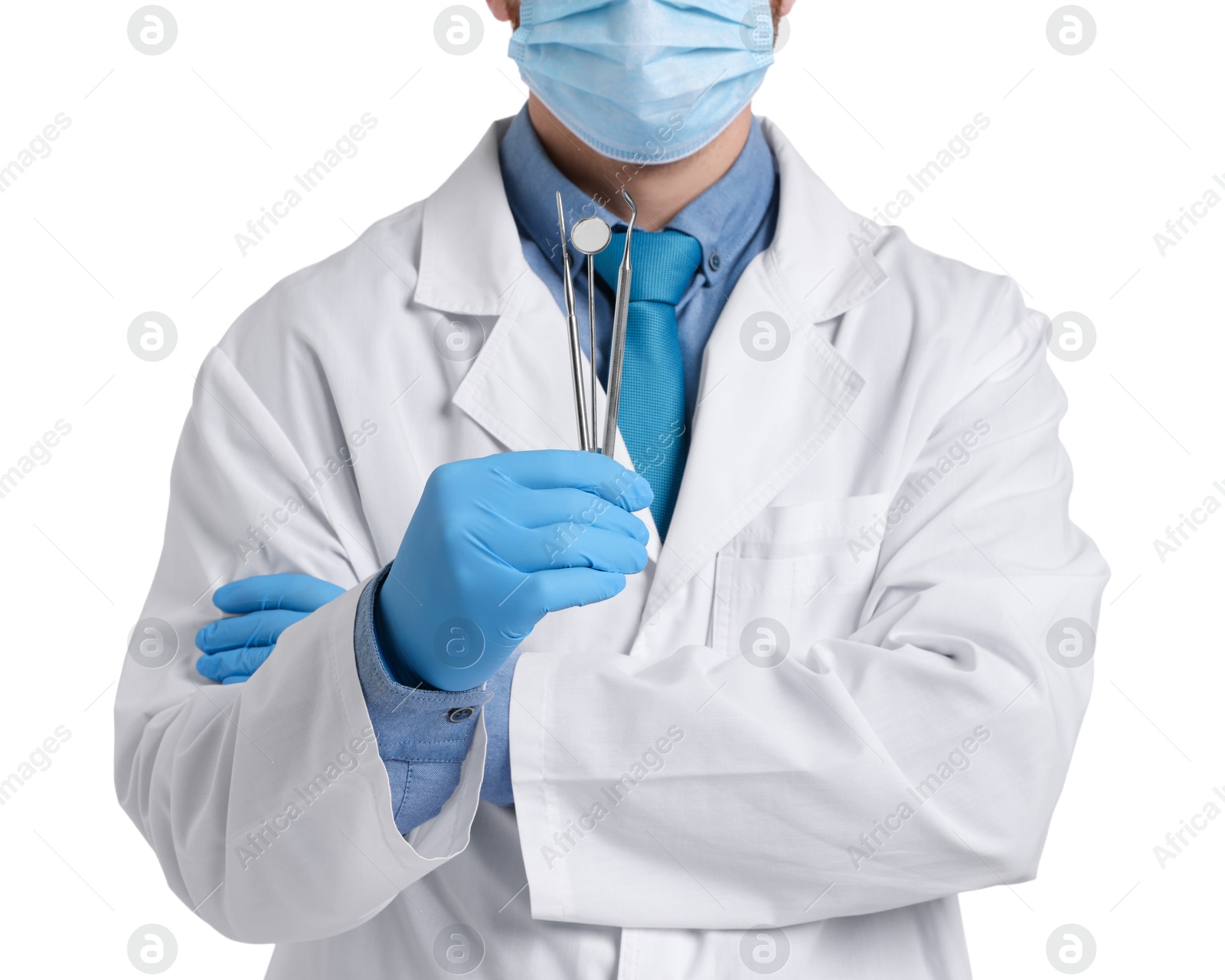 Photo of Professional dentist with tools on white background, closeup