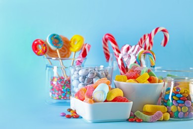 Photo of Candy bar. Many different sweets on light blue background