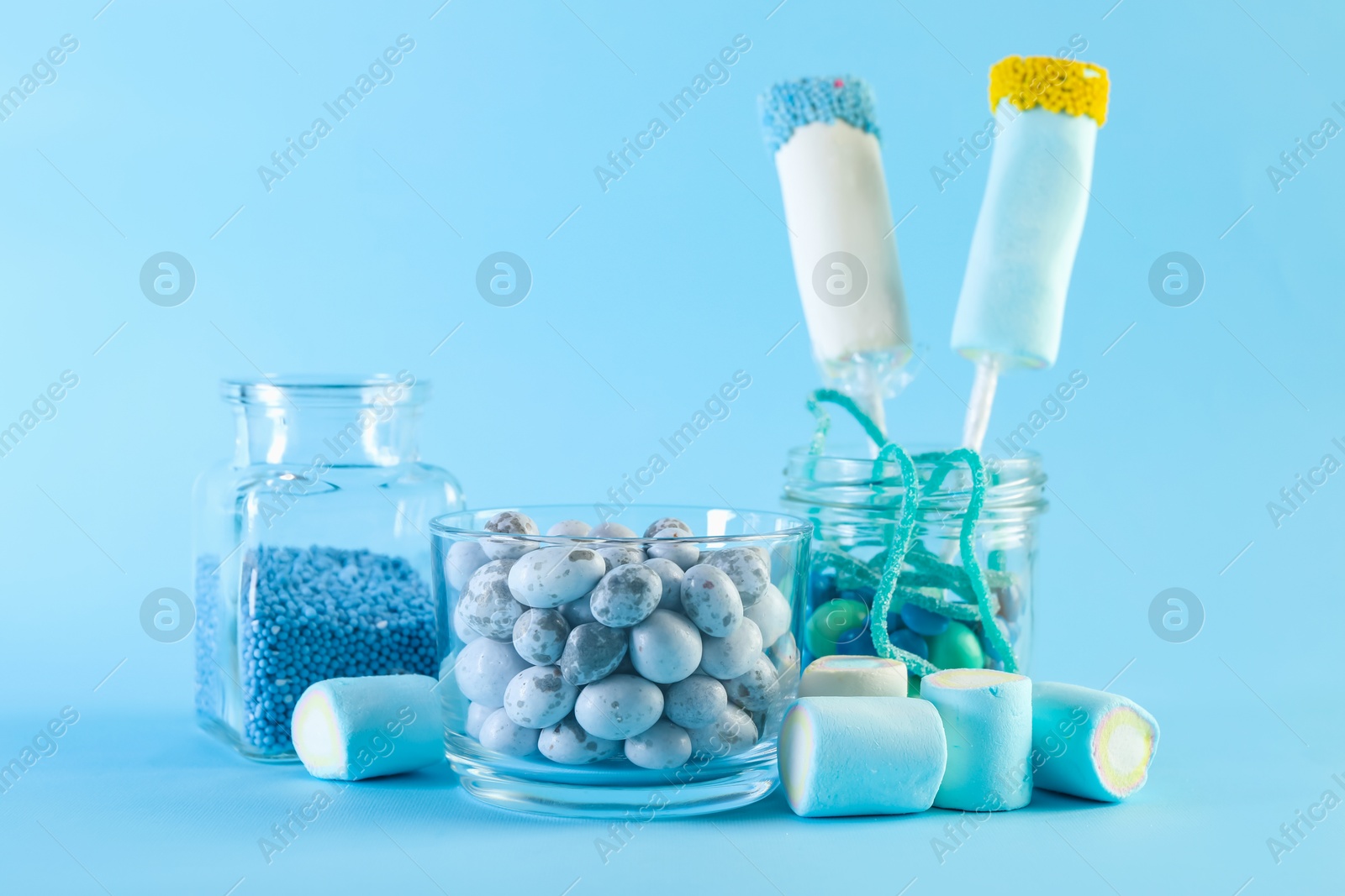 Photo of Candy bar. Many different sweets on light blue background