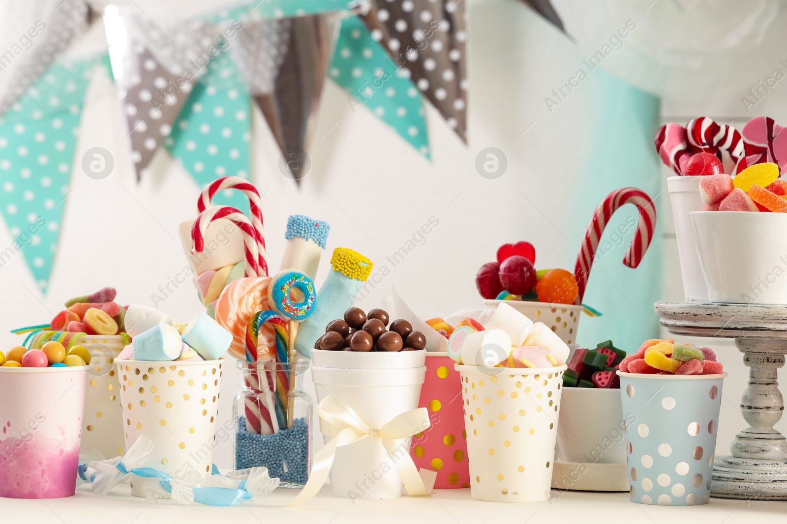 Photo of Candy bar. Different yummy sweets on white table indoors