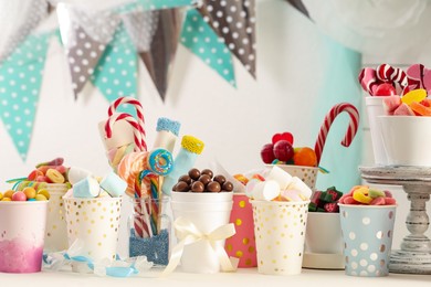 Candy bar. Different yummy sweets on white table indoors