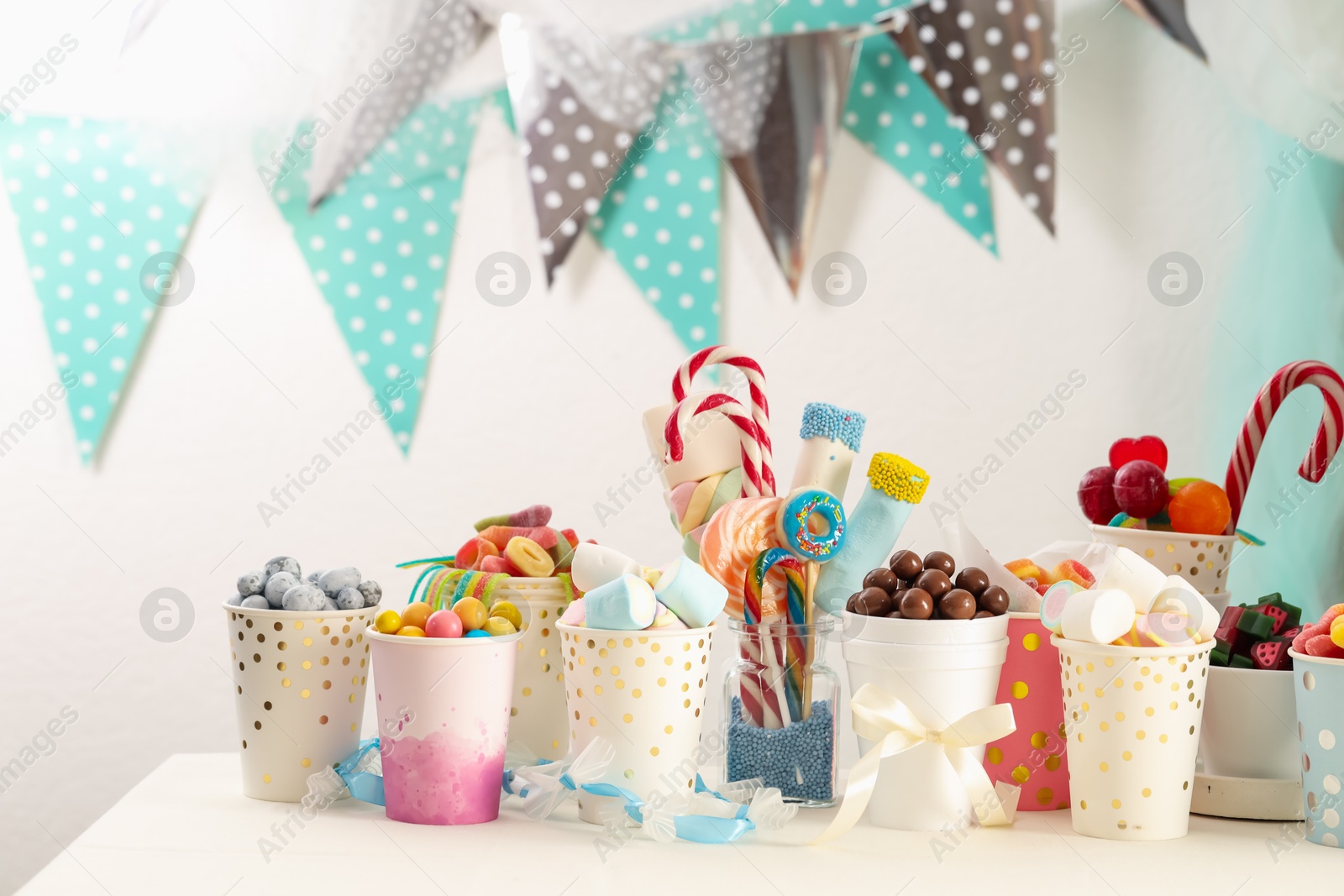 Photo of Candy bar. Different yummy sweets on white table indoors