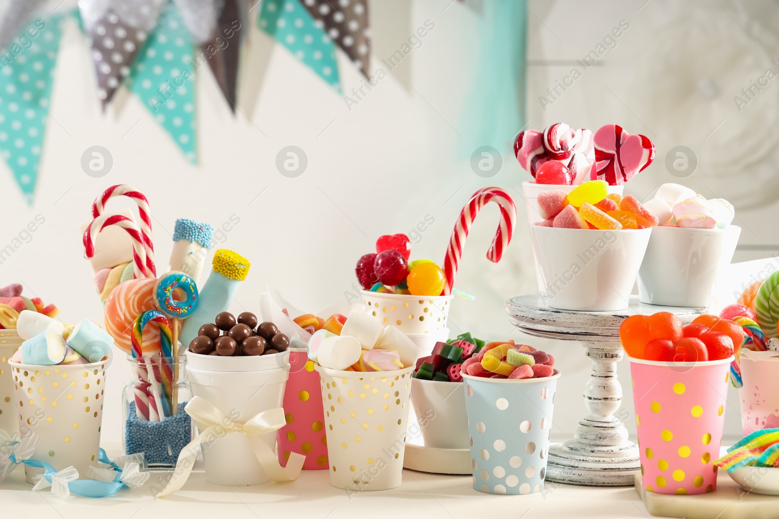 Photo of Candy bar. Different yummy sweets on white table indoors