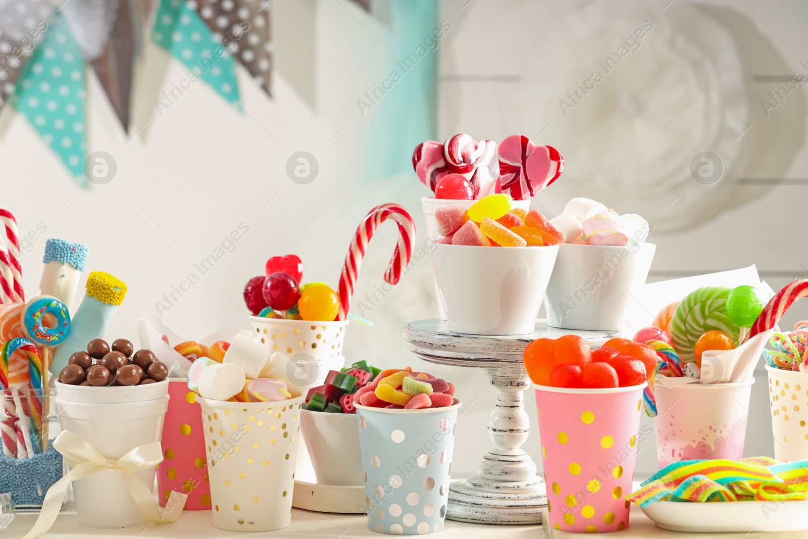 Photo of Candy bar. Different yummy sweets on white table indoors