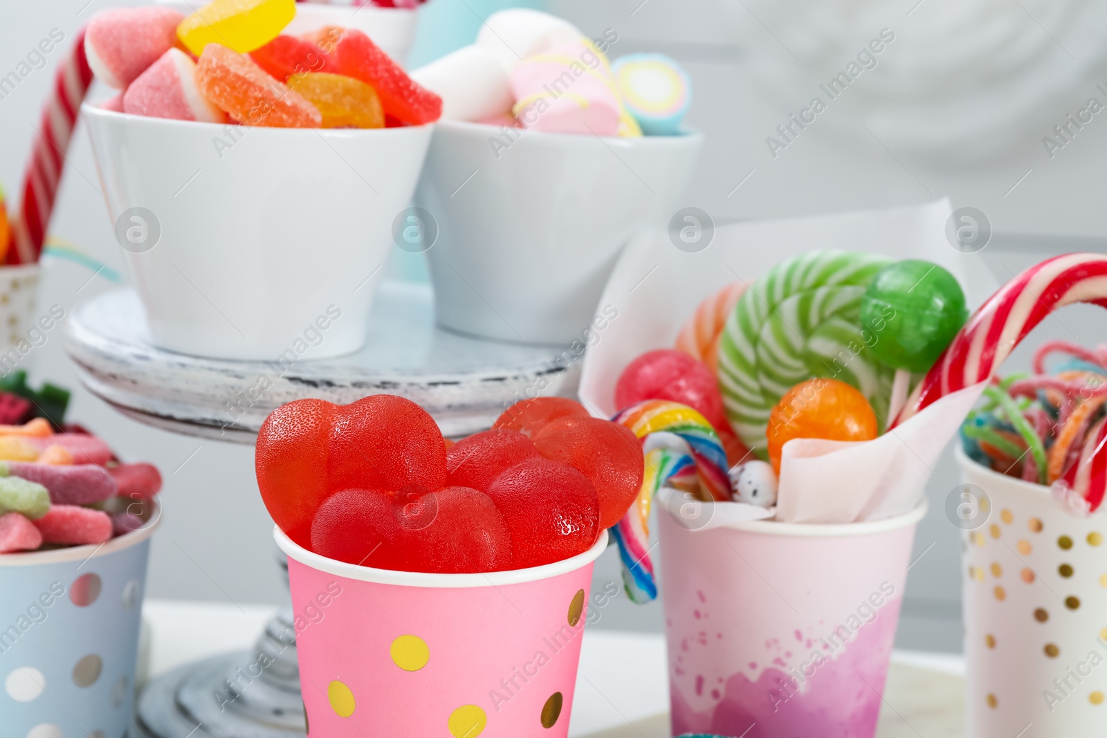 Photo of Candy bar. Different yummy sweets on white table indoors, closeup