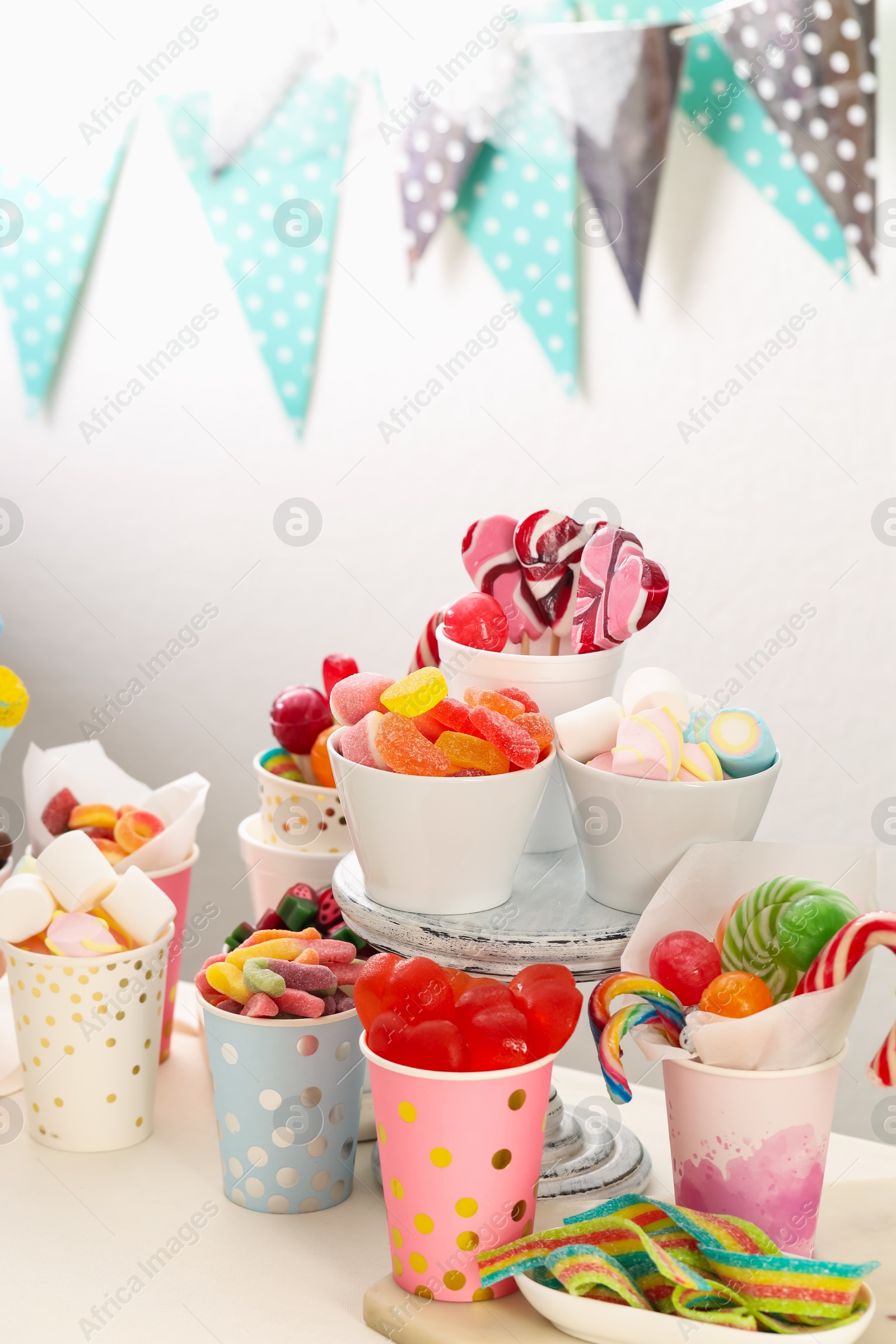 Photo of Candy bar. Different yummy sweets on white table indoors