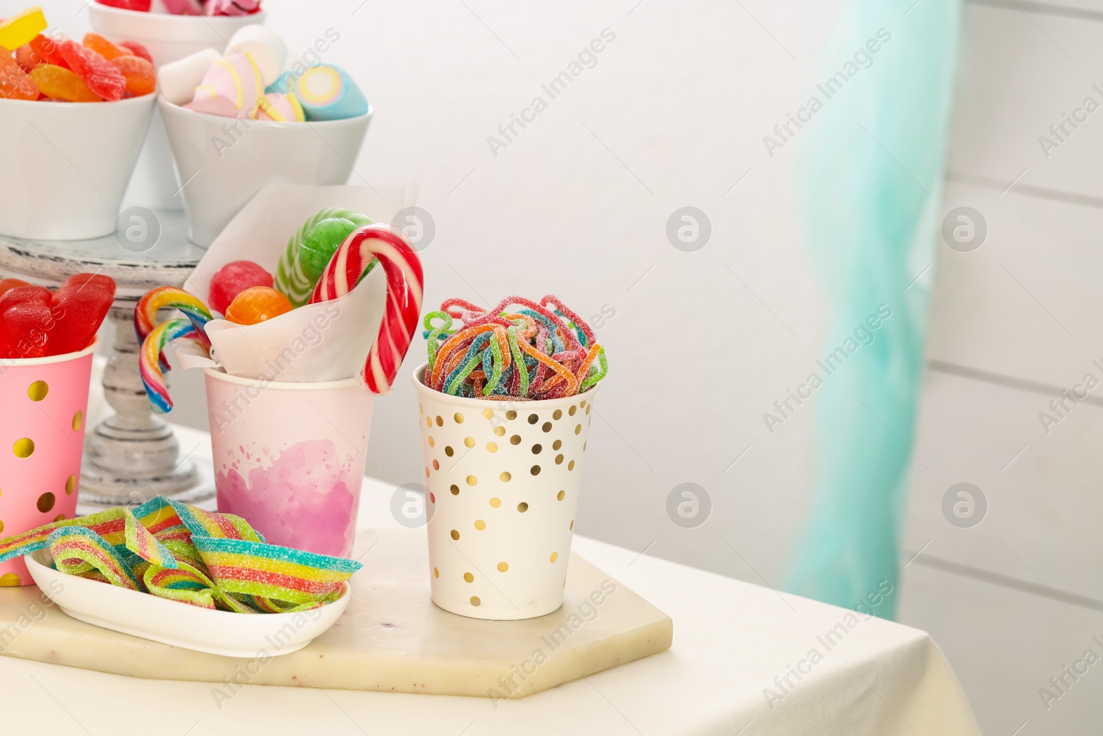 Photo of Candy bar. Different yummy sweets on white table indoors. Space for text