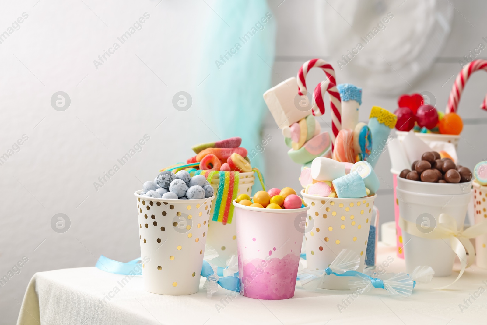 Photo of Candy bar. Different yummy sweets on white table indoors. Space for text