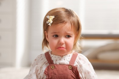 Photo of Cute little baby girl crying at home