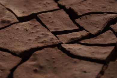 Photo of Dry cracked ground as background, closeup. Global warming