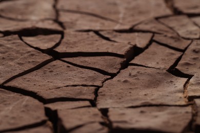 Dry cracked ground as background, closeup. Global warming