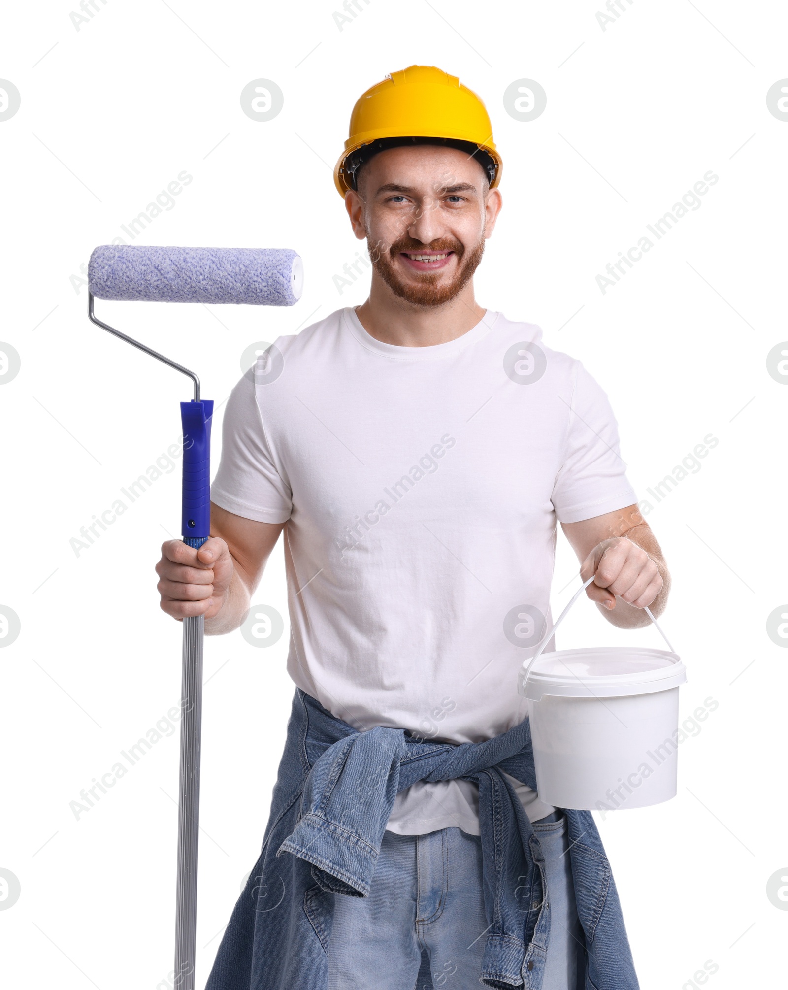 Photo of Man wearing hardhat with roller and bucket of paint on white background