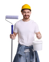 Man wearing hardhat with roller and bucket of paint on white background