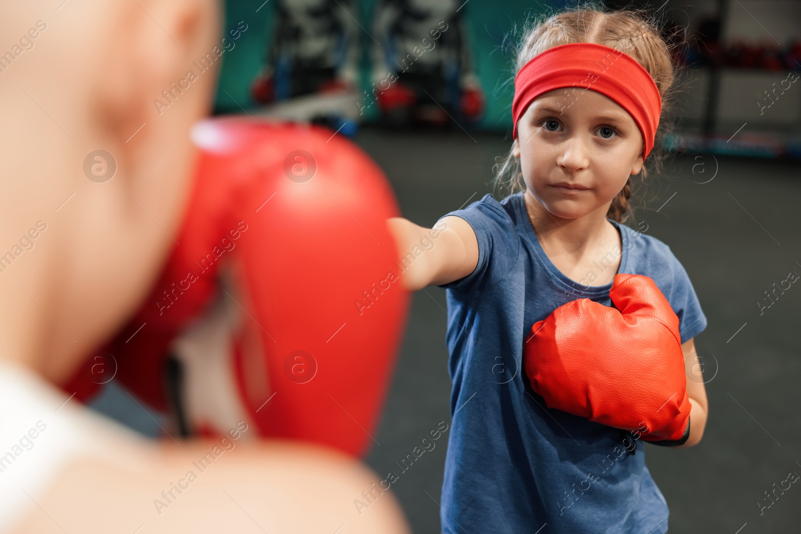 Photo of Children having boxing practice in training center