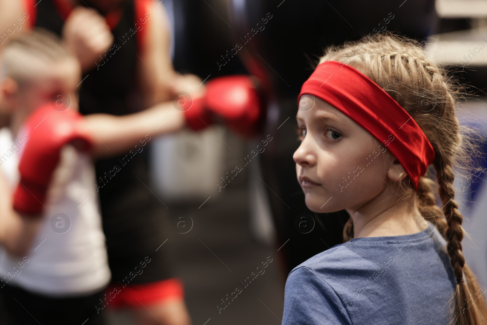 Photo of Girl at boxing practice in training center