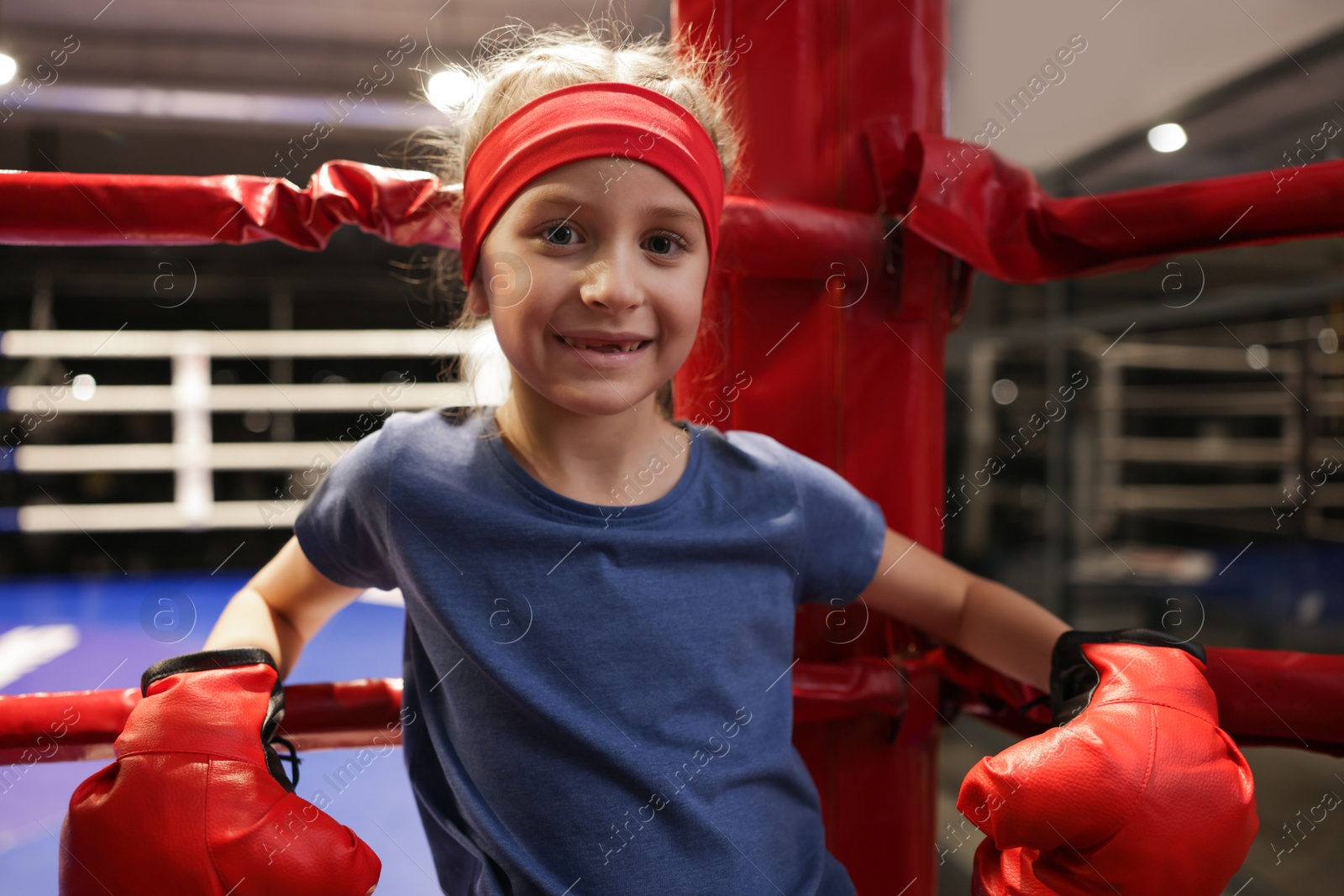 Photo of Girl sitting in her corner of boxing ring