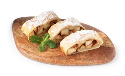 Photo of Pieces of tasty apple strudel with powdered sugar and mint isolated on white